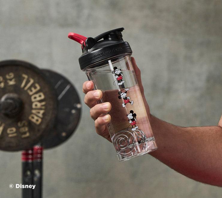 pro-series-l4 Mickey_Mouse_Protein_Shaker_Bottle_Being_Held_In_the_Gym.jpg